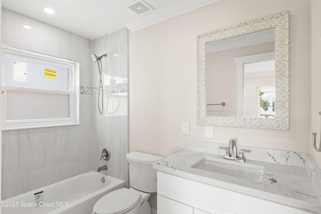 full bathroom featuring vanity, toilet, and tiled shower / bath