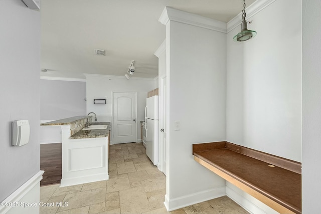 bathroom with sink and ornamental molding