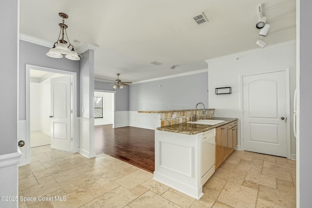 kitchen with pendant lighting, white dishwasher, sink, ceiling fan, and kitchen peninsula