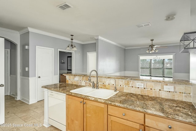 kitchen with dishwasher, ceiling fan, ornamental molding, and sink