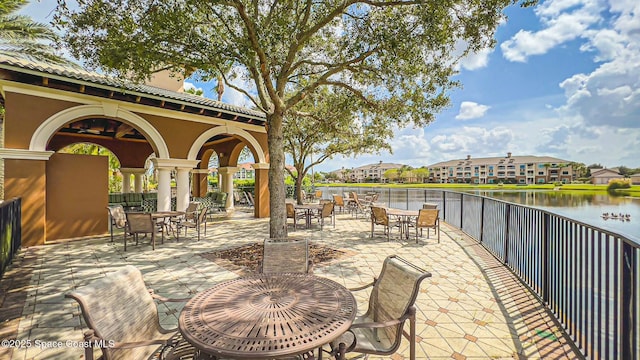 view of patio with a water view