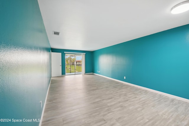 spare room with light hardwood / wood-style floors