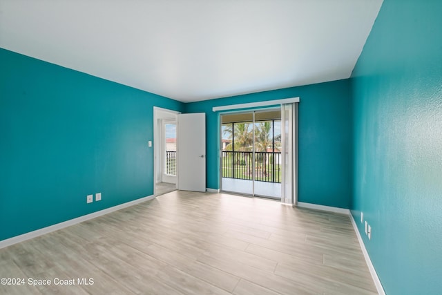 spare room featuring light wood-type flooring