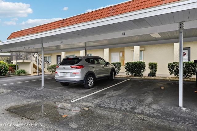 view of parking / parking lot with a carport