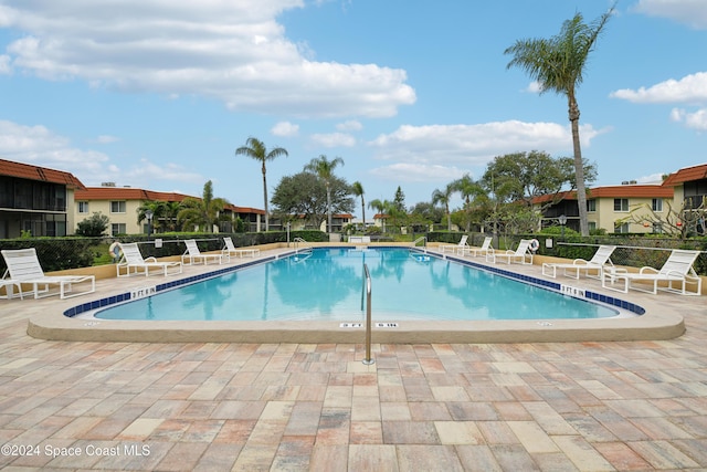 view of swimming pool with a patio