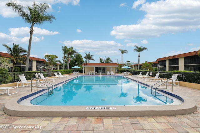 view of swimming pool featuring a patio area