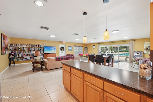 kitchen featuring light tile patterned floors and decorative light fixtures