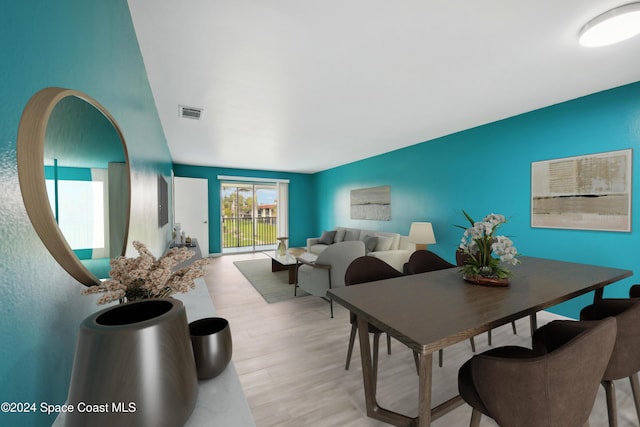 dining area with light hardwood / wood-style floors