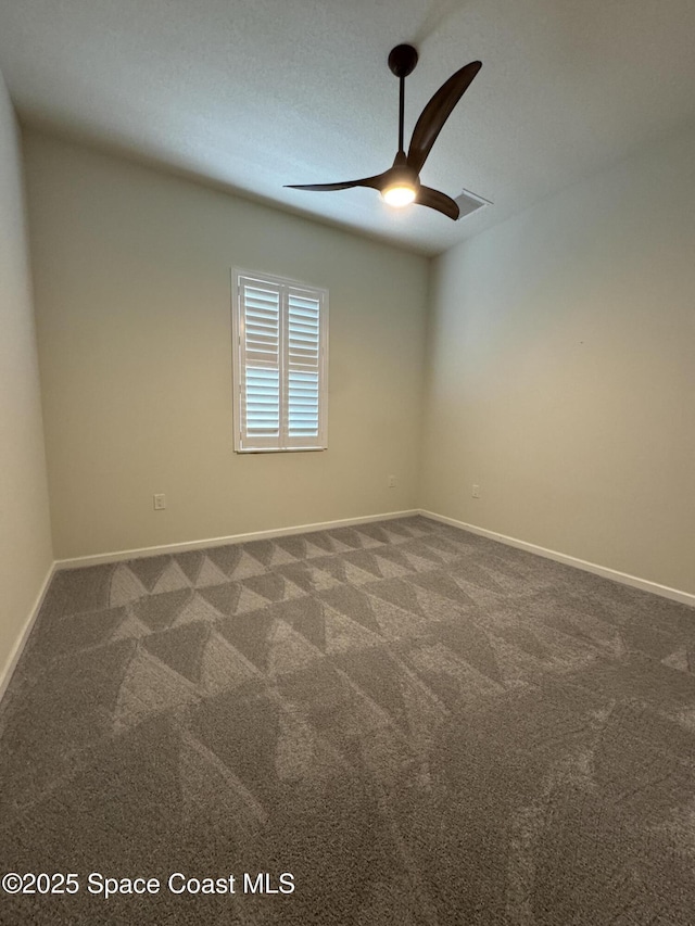 carpeted empty room with ceiling fan