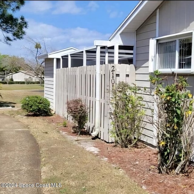 view of property exterior with fence