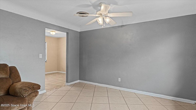 tiled empty room with ceiling fan