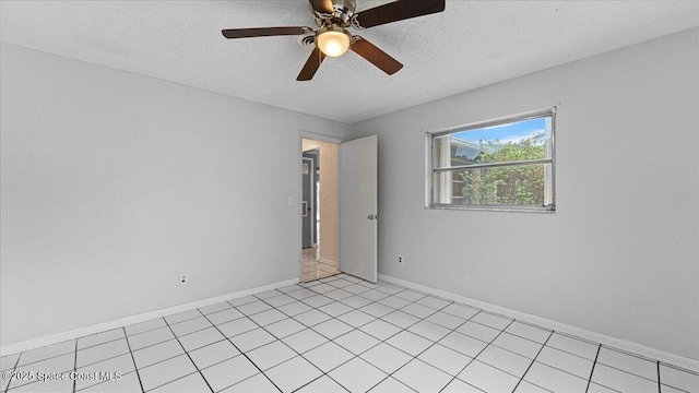 spare room with ceiling fan and a textured ceiling