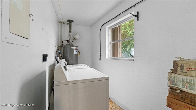 washroom featuring washer and dryer and water heater