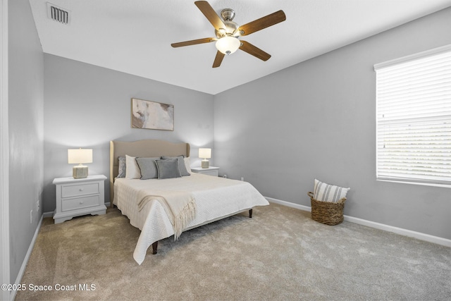 bedroom with light colored carpet and ceiling fan