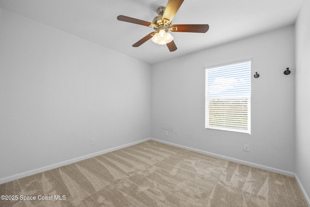 unfurnished room featuring light carpet and ceiling fan