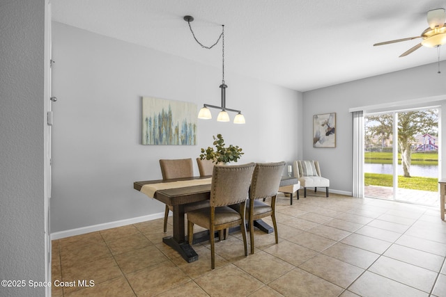 tiled dining room with ceiling fan