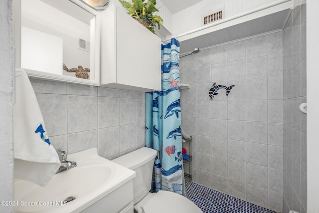 bathroom with decorative backsplash, vanity, toilet, and curtained shower