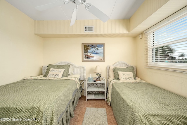 bedroom featuring tile patterned floors and ceiling fan