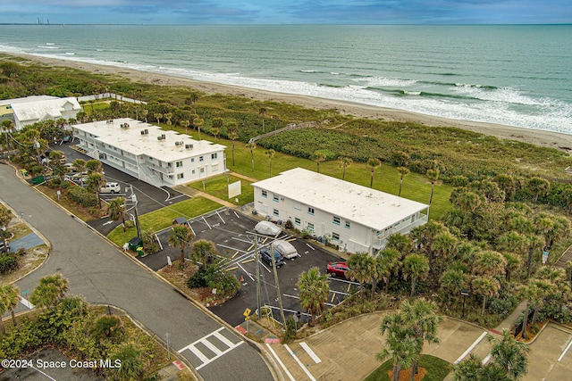 drone / aerial view with a view of the beach and a water view