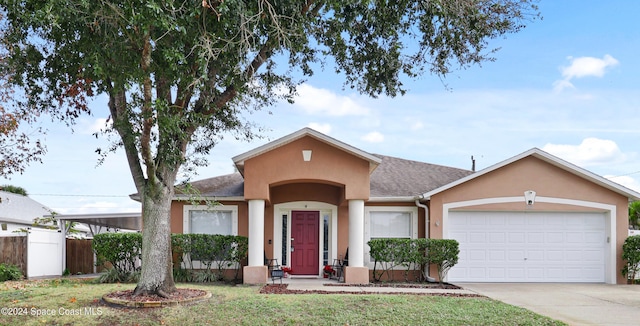 single story home featuring a front yard and a garage