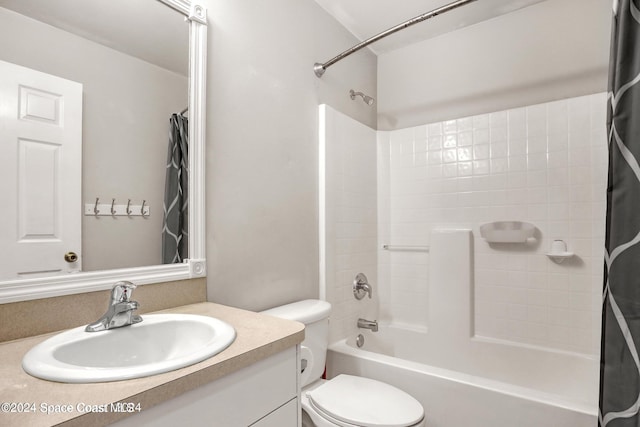 full bathroom with vanity, toilet, and shower / tub combo with curtain