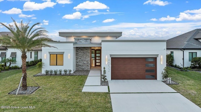 contemporary house with a front lawn, a garage, and french doors