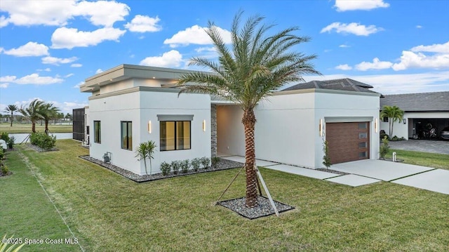 contemporary home featuring a front yard and a garage