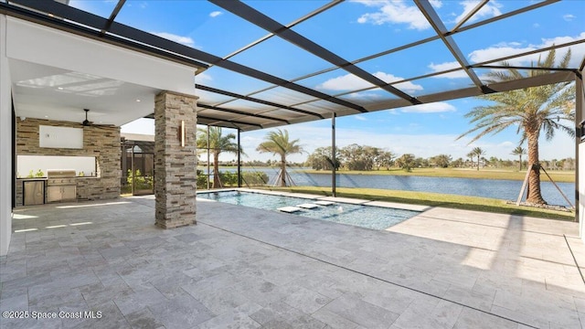 view of swimming pool featuring area for grilling, a patio area, a water view, and glass enclosure