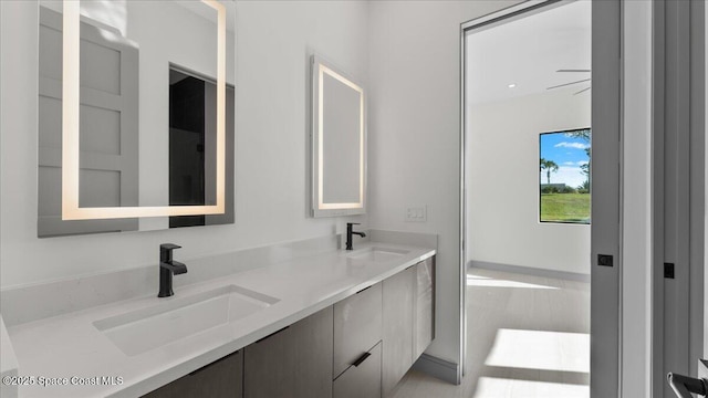 bathroom featuring vanity and ceiling fan