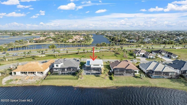 bird's eye view with a water view