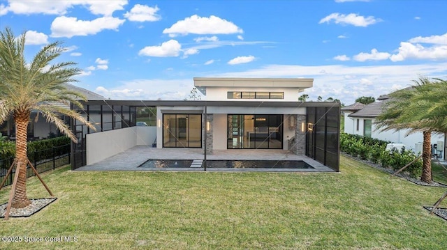 back of property featuring a patio area and a yard