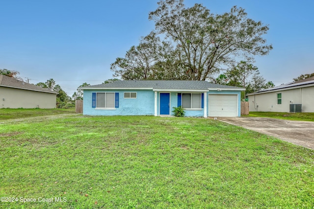 single story home with central AC, a front lawn, and a garage