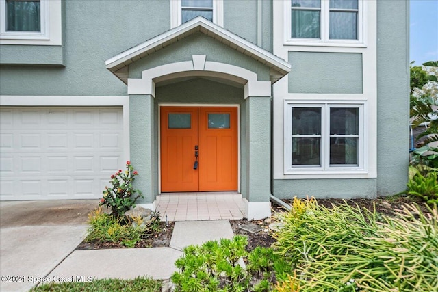 property entrance with a garage