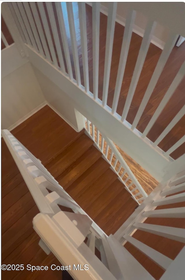 stairway featuring hardwood / wood-style flooring