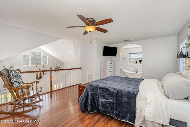 bedroom with ceiling fan, vaulted ceiling, and hardwood / wood-style flooring