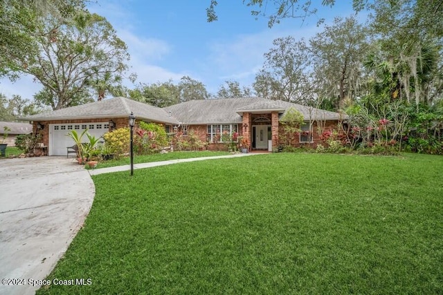 ranch-style house with a garage and a front yard