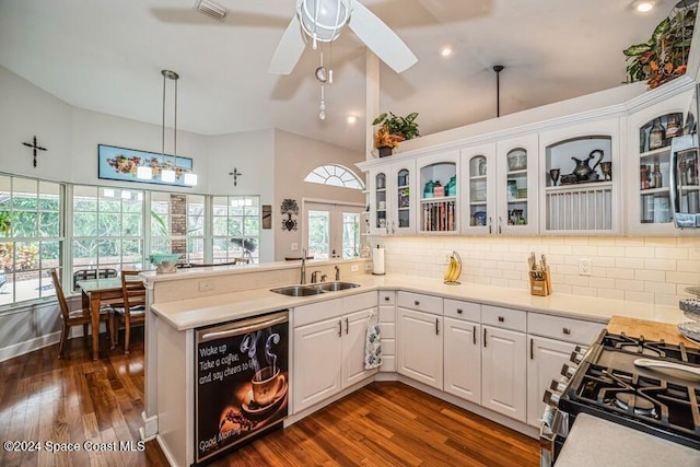 kitchen featuring kitchen peninsula, appliances with stainless steel finishes, white cabinetry, and sink