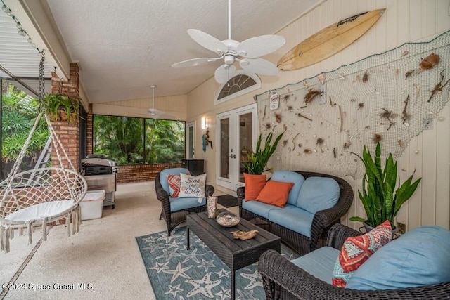 view of patio with ceiling fan, area for grilling, an outdoor hangout area, and french doors