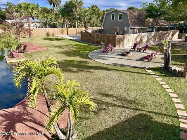 view of yard with a fire pit and a patio area