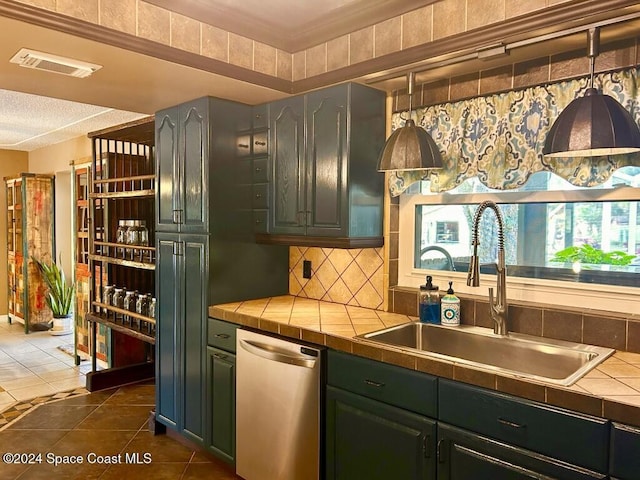 kitchen featuring tile countertops, backsplash, dark tile patterned flooring, sink, and stainless steel dishwasher