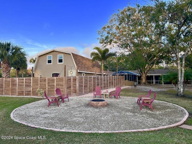 view of playground featuring an outdoor fire pit