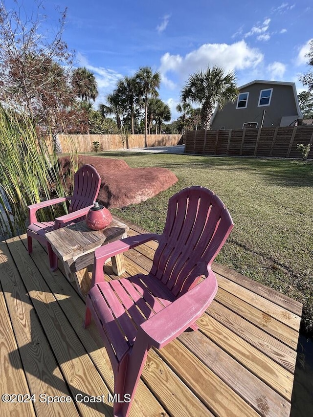 wooden deck with a yard