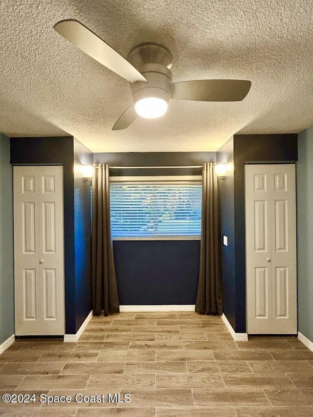 unfurnished room with ceiling fan