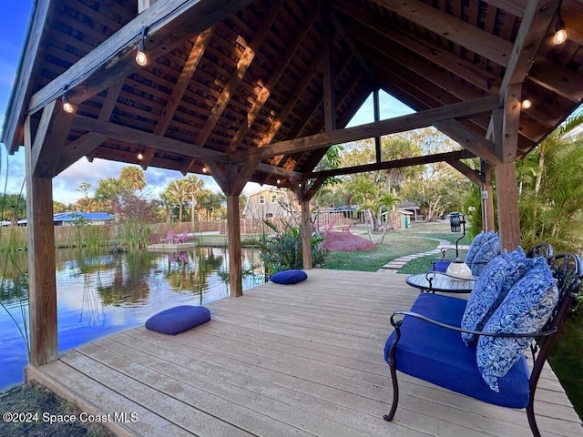 dock area with a gazebo and a water view