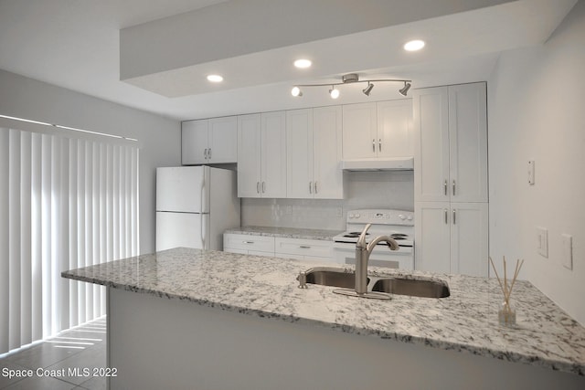 kitchen featuring light stone countertops, white appliances, white cabinetry, and sink