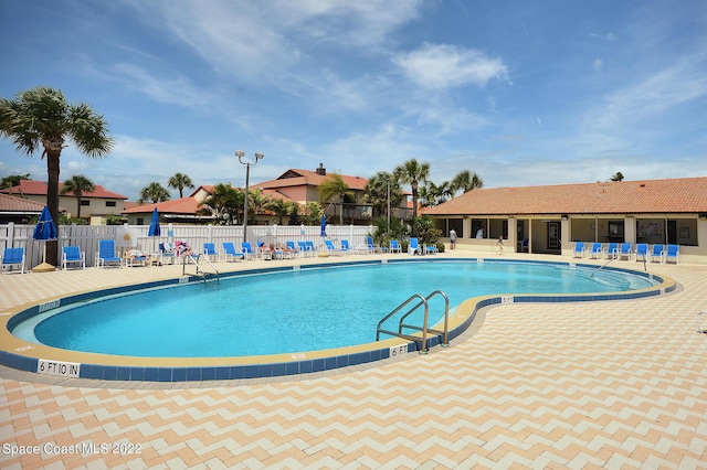 view of swimming pool featuring a patio