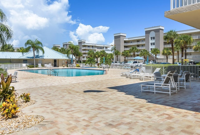 view of swimming pool featuring a patio area