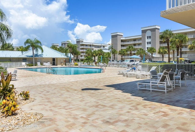 601 Shorewood Dr Unit 402, Cape Canaveral, FL 32920 - community pool featuring a patio