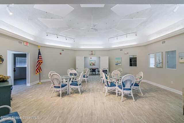 601 Shorewood Dr Unit 402, Cape Canaveral, FL 32920 - dining room with track lighting, wood finished floors, ceiling fan, and a textured ceiling