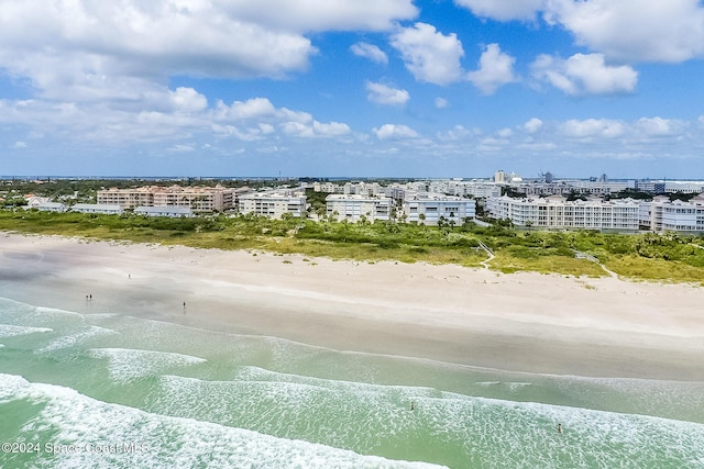 aerial view featuring a view of the beach and a water view